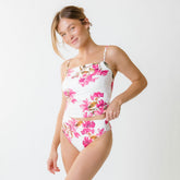 Front view of Villa Almost Cheeky Bottoms showcasing white floral print and cheeky fit on model against white background