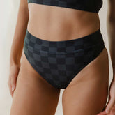 Front close-up of Slate Check Almost Cheeky Bottoms showcasing the dark checker pattern and waistband on a model