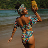 Rear view of Costa Floral Almost Cheeky Bottoms showcasing floral print and cheeky coverage on a model by a lake