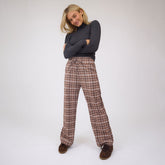 Front view of Audrey Trouser in Toffee Plaid showcasing wide-leg fit and drawstring waist on a model against a light studio background