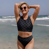 Front view of Slate Check Almost Cheeky Bottoms showcasing the slate checkered pattern and cheeky fit on a model at the beach