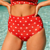 Close-up front view of red Star High-Waisted Bottoms showcasing white star print and high waist with pool background