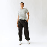 Front view of black Jetsetter Cargo Joggers showcasing cargo pockets and relaxed fit on a model against a white background