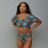 Front view of Costa Floral Almost Cheeky Bottoms showcasing the floral pattern and almost cheeky fit on a model against a gray background