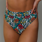 Front close-up of Costa Floral Almost Cheeky Bottoms showcasing a colorful floral print on a model against a neutral background